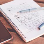 a notebook showcasing ideas and reasons to rebuild a website from the ground up